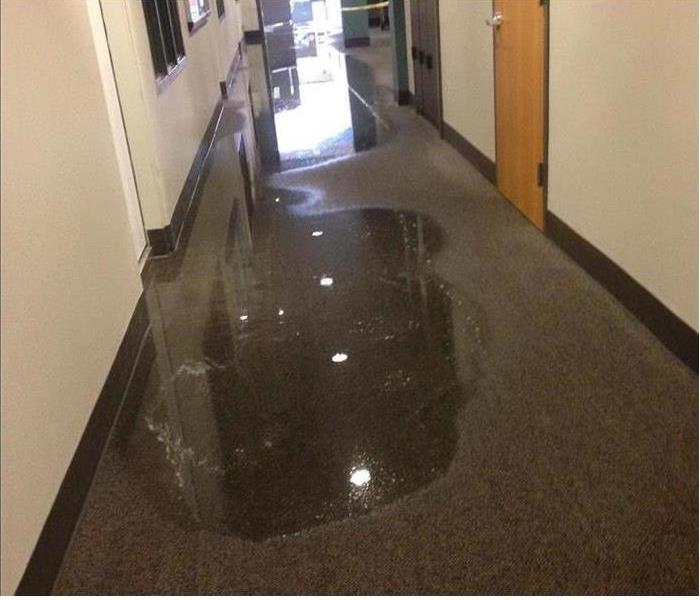 pooling water covering corridor in a school 