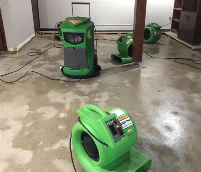 Water damage in the basement of a home, with SERVPRO equipment. 