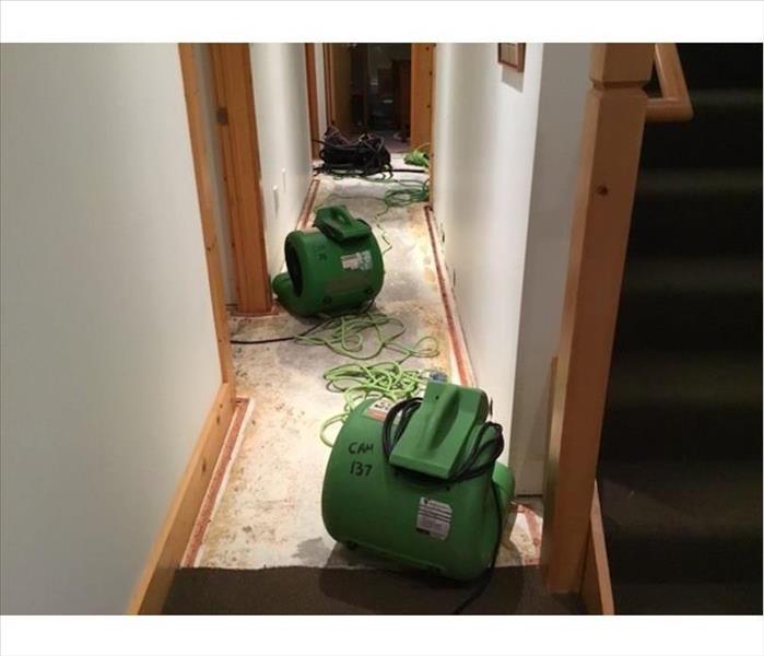 air movers on stripped floor in hallway